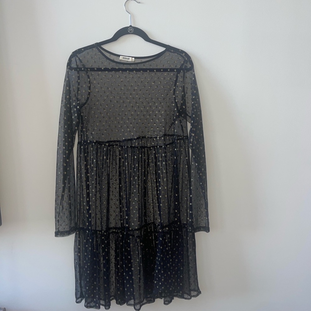 Sheer dress with gold dots.